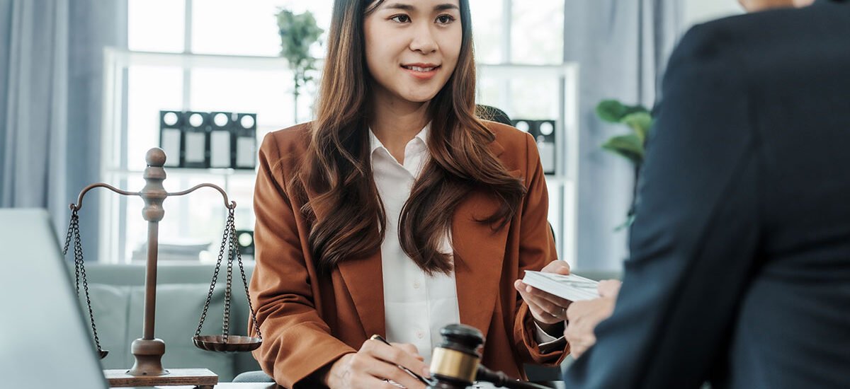 Female lawyer consulting client in office