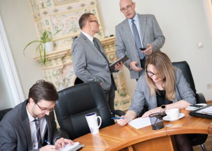 Business meeting with colleagues taking notes