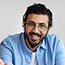Smiling bearded man wearing glasses